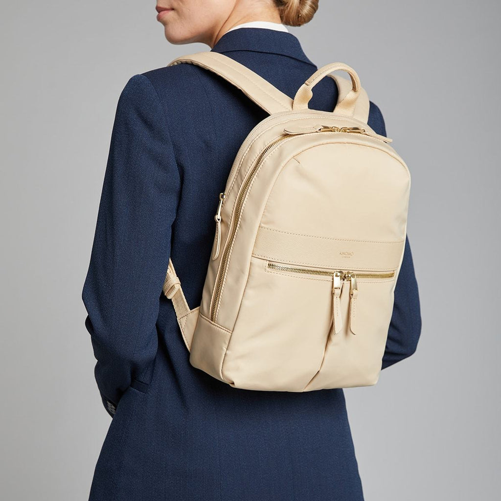 KNOMO Mini Beaufort Backpack Female Model Wearing 12" -  Trench Beige | knomo.com