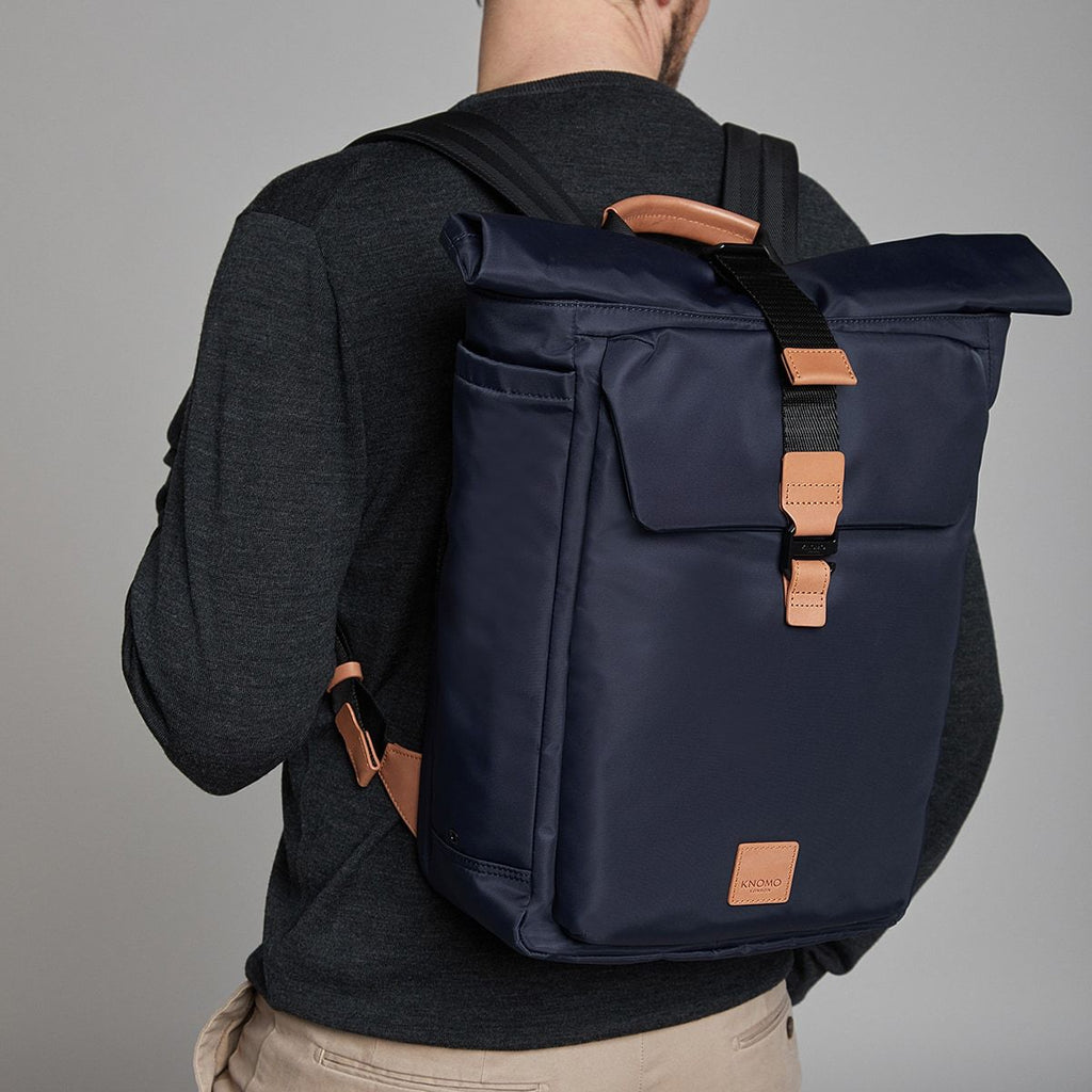 KNOMO Novello Roll-Top Laptop Backpack Male Model Wearing 15" -  Dark Navy | knomo.com